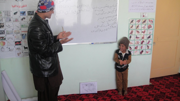 Teacher interacting with child section image