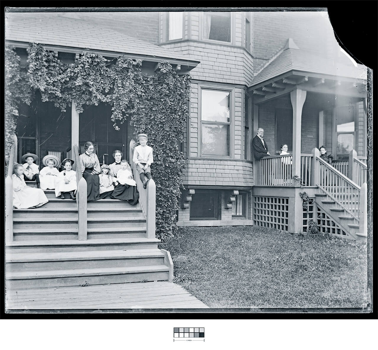IMAGE and TEXT: The Pullman Neighborhood - Group of people sitting on front stoop section image